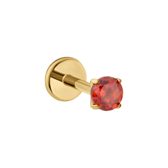 A gold-plated labret stud earring featuring a round-cut dark orange gemstone in a four-prong setting, shown against a plain white background.