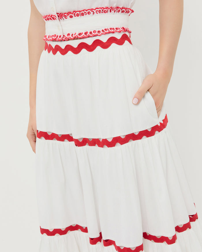 Aimee Skirt in white cotton with red accents and Veda Top in white cotton with red accents.