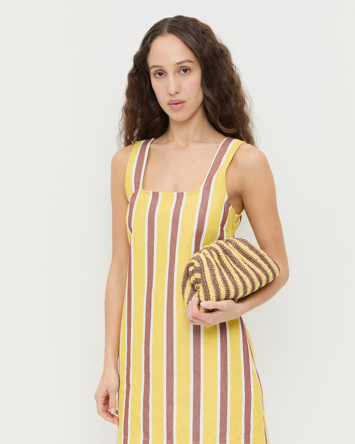 Bailey Brown/Butter Stripe Dome Clutch in brown and butter striped raffia and Havi Mini Dress in yellow and brown striped cotton.