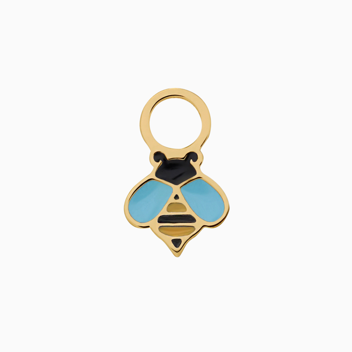 A close up of a bumblebee shaped hoop charm with yellow and black enamel and gold-plated titanium metal on a white background