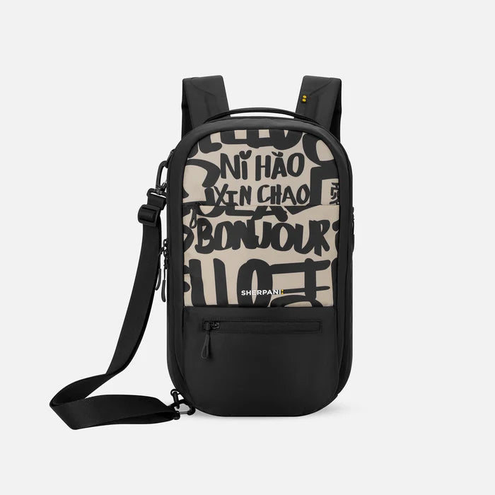 A Sherpani Camden Ciao Ultimate Backpack, front view showing various pockets and strap options on white backdrop.  #color_ciao-print