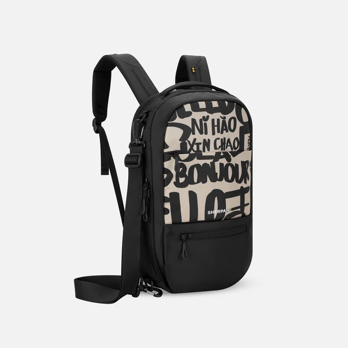 A Sherpani Camden Ciao Ultimate Backpack, 3/4 view showing various pockets and strap options on white backdrop. #color_ciao-print