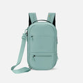 A Sherpani Camden Surf Blue Ultimate Backpack, front view showing various pockets and strap options on white backdrop.  #color_surf-blue