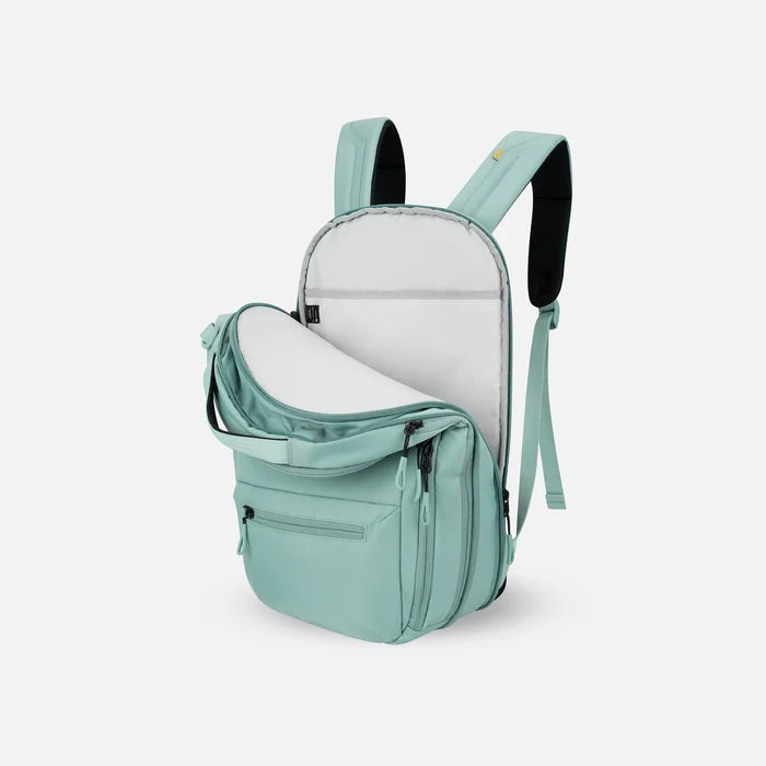 A Sherpani Camden Surf Blue Ultimate Backpack, 3/4 view showing inside of laptop pocket on a white background.    #color_surf-blue