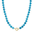 Blue beaded necklace with a gold clasp on a white background