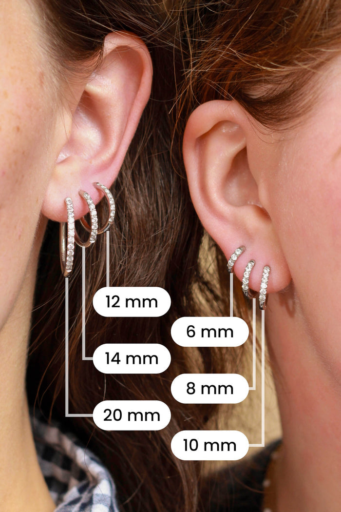 Comparison of 6 different sizes of silver hoops on the ears of 2 models.