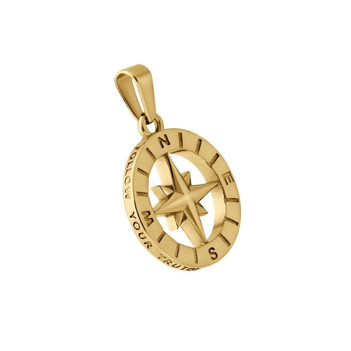 Gold compass pendant on a white background