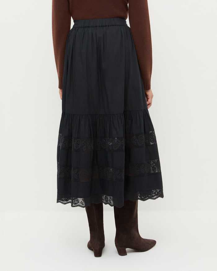 Delaney Skirt in black cotton, Tucker Cashmere Cardigan in brown, and Cleo Brown Suede Mid-Calf Boot.