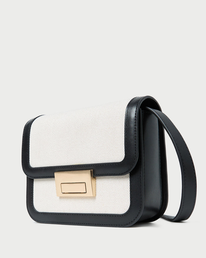 Desi Black/Natural Canvas Crossbody in natural canvas with black leather accents.