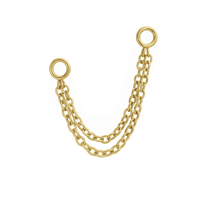 Close up of an earring accessory that features two layered chains attached to small rings at both ends of the chain. Called connector chains, these accessories are design to link with another earring, like a flat back stud, via the small rings. Made from 316L Surgical Steel and finished with 18K Gold PVD plating.