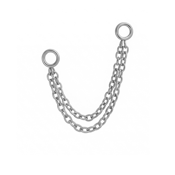 Close up of an earring accessory that features two layered chains attached to small rings at both ends of the chain. Called connector chains, these accessories are design to link with another earring, like a flat back stud, via the small rings. Made from 316L Surgical Steel.
