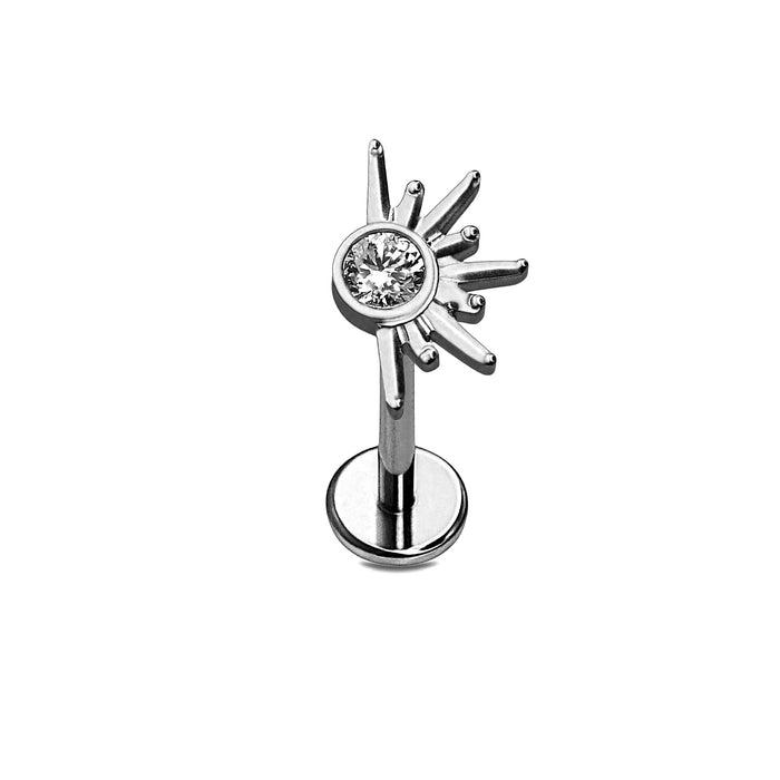 Silver half-sun-shaped earring with a central gemstone on a white background