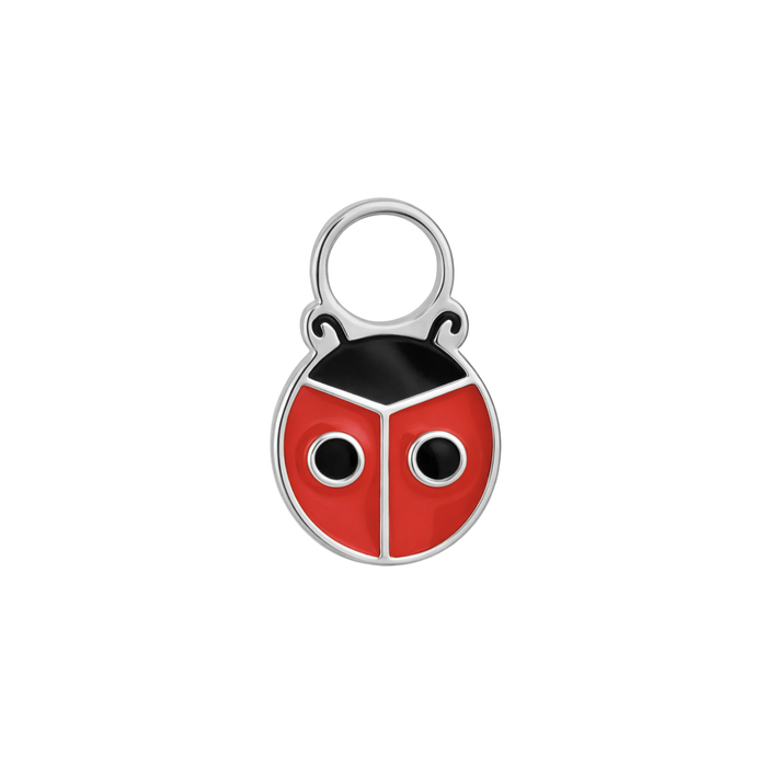 A close up of a ladybug shaped hoop charm with red and black enamel and titanium metal on a white background