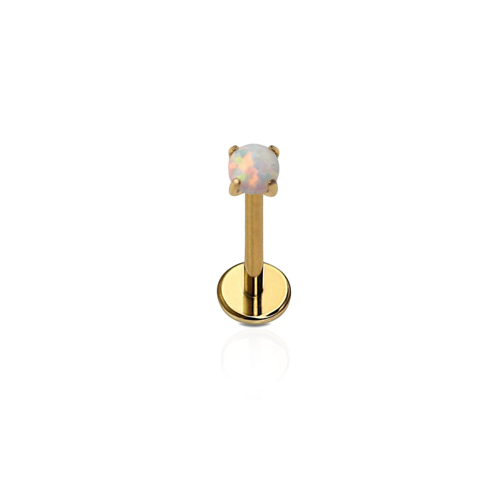 A single gold-colored titanium flat back stud with a prong-set synthetic opal.