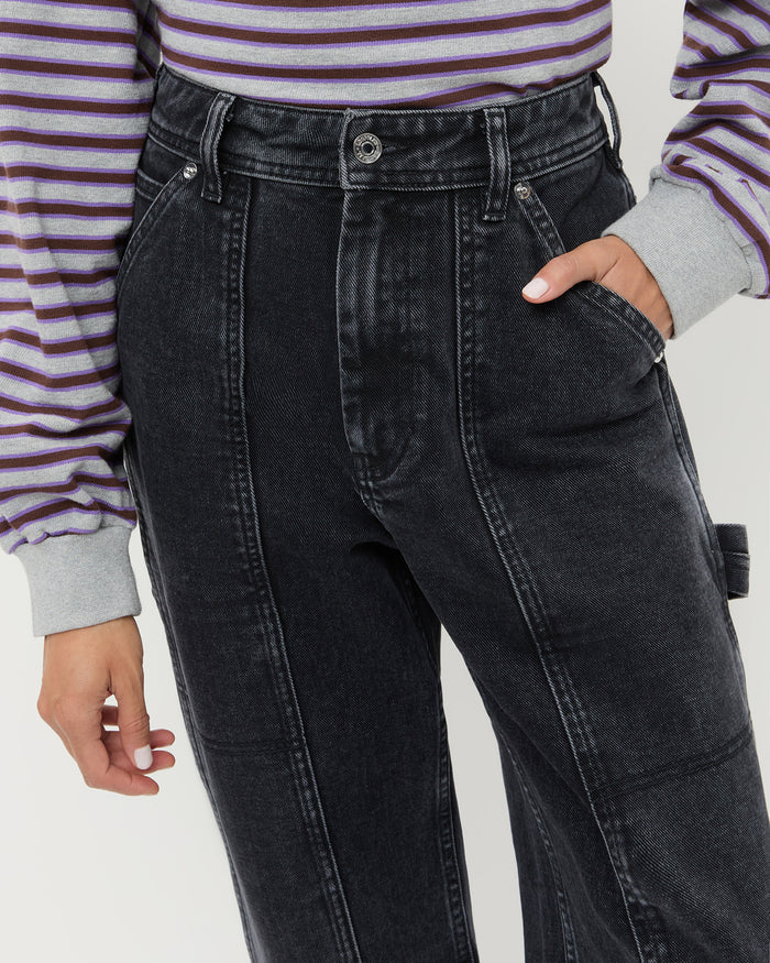 Molly Workwear Jean in washed black denim, and Scout Long-Sleeve Top in grey and purple cotton.