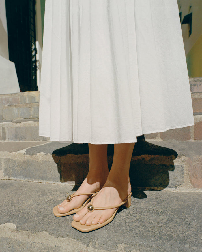 Odessa Dune Leather Heeled Sandal in dune tan leather with a gold ball accent.