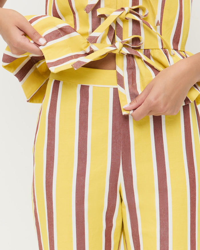 Pasha Trouser in yellow and brown striped cotton-linen and Pilar Tie-Front Top in yellow and brown striped cotton-linen.