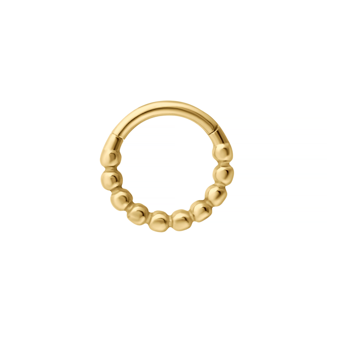 Close up of a clicker-style hoop featuring a bubble-like metal pattern on the bottom 3/4 of the hoop. Designed for Daith or Septum piercings, and made from ASTM F136 Implant-Grade Titanium, finished with 18K Gold PVD plating