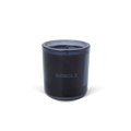 The Shinola Rhythm 8 oz Scented Candle features a dark blue recycled glass holder with "SHINOLA" on the front and a blue coconut soy single-wick candle, displayed against a plain white background.