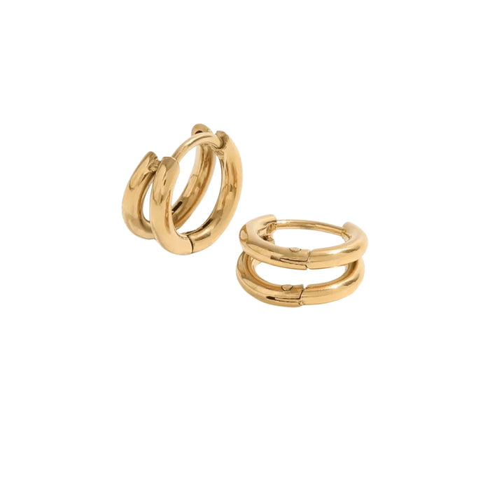 Pair of gold hoop earrings on a white background