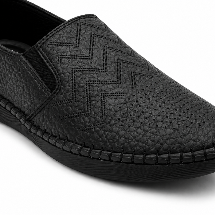 Slip-on flats with perforated geometric details