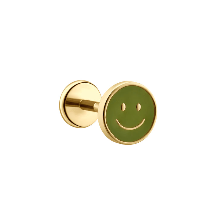 A gold-tone circular stud earring featuring a green smiley face design on the face disc, shown against a plain white background.