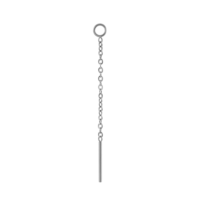 Close up on an earring accessory that features a thin chain with a small ring at one end, and a small rod at the other. The ring is is designed to link with another earring, like a hoop or a flat back stud, and the chain and rod are designed to thread through another peircing, or hang like a charm. Made from 316L Surgical steel.