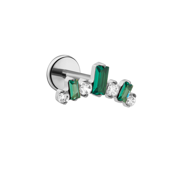 earring with green gemstones on a white background