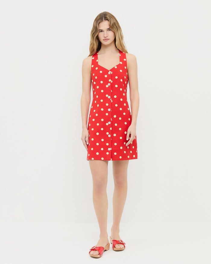 Tova sleeveless mini button-up dress in red cotton-linen with white polka dots and Paulie Red Studded Sandal.