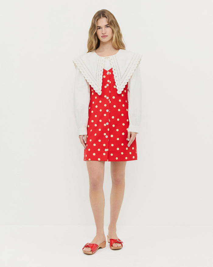 Tova sleeveless mini button-up dress in red cotton-linen with white polka dots, Paulie Red Studded Sandal, and Ken Shirt in white cotton.