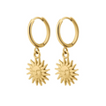 Gold hoop earrings with sun-shaped charms on a white background